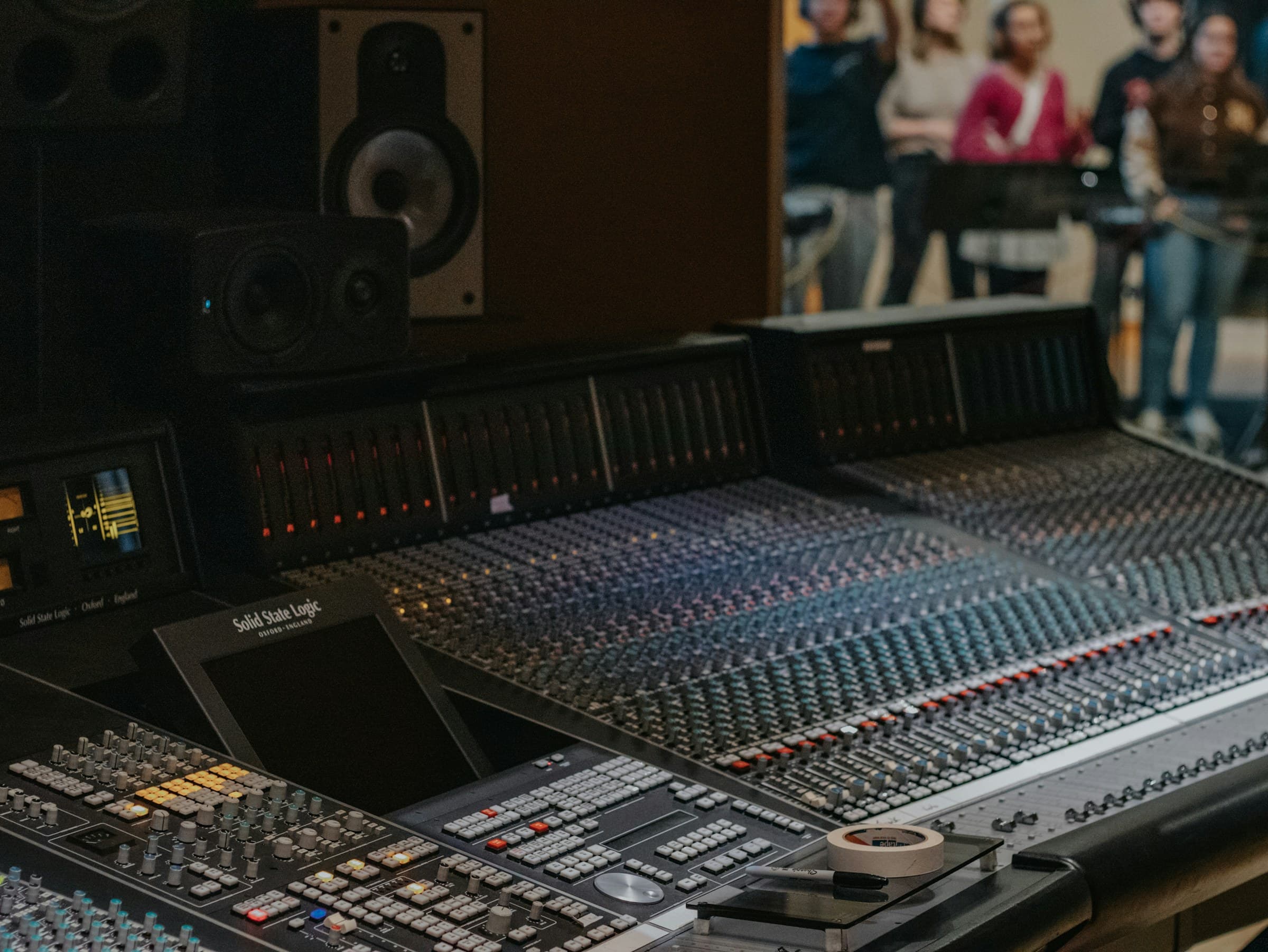 Recording studio console representing the creative work behind IHQ